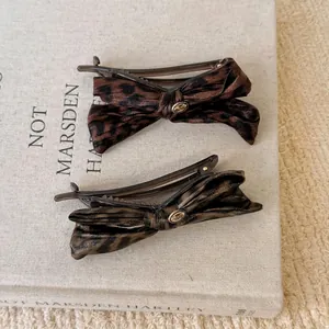 Retro leopard print bow hair clips with gold metal buckle set for elegant hairstyles