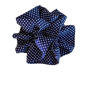 Navy blue polka dot scrunchie with silky fabric texture and retro Korean style