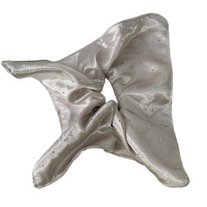 Elegant champagne satin scrunchie with sparkling rhinestones for hair styling