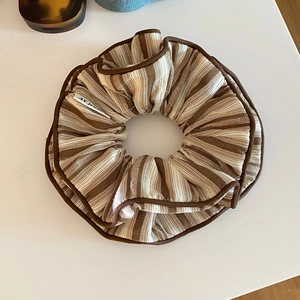Retro striped fabric oversized hair scrunchie with brown and cream vertical patterns