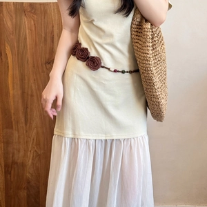Bohemian floral beaded belt on minimalist cream knit dress with white pleated mesh hem