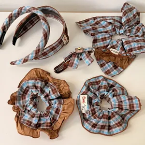 Blue and brown plaid hair accessory set including scrunchies and bow clips