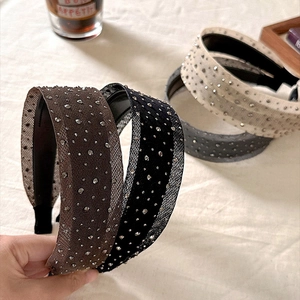 Sparkling rhinestone padded headbands in four colors with mesh overlay and non-slip lining