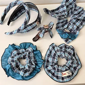 Blue and black plaid hair accessories set including headbands, scrunchies and bow clips