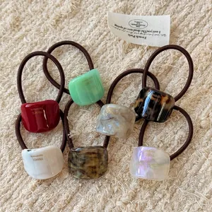 Set of 7 colorful acrylic hair ties with marble patterns and high elasticity bands
