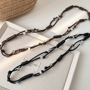 Bohemian style woven waist chains in black and brown with beads for women dresses