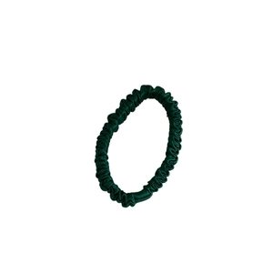 Elegant dark green silk satin hair scrunchie with glossy finish and pleated texture
