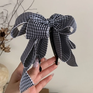Große schwarz-weiße Gingham-Schleife Bananenspange für elegante Pferdeschwanz Frisuren