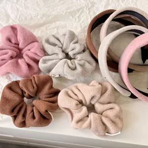 Set of soft plush scrunchies and headbands in elegant solid colors for winter season