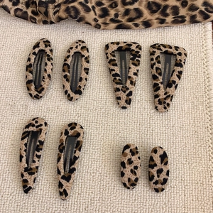 8-piece leopard print fabric hair clips set including oval triangle and teardrop shapes