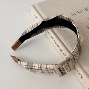 Retro plaid wide headband with square buckle detail on cream book background