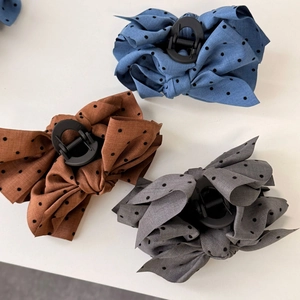 Retro polka dot bow hair claws in blue, brown, and grey fabric finish for women