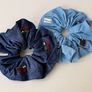 Blue denim hair scrunchies with red cherry embroidery and elegant pearl accents
