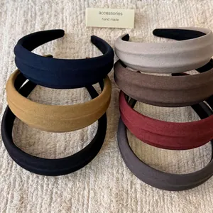 Retro style set of seven wide textured headbands in assorted solid matte colors