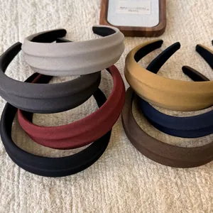 Pile of colorful thick padded sponge headbands with twill fabric texture in retro style