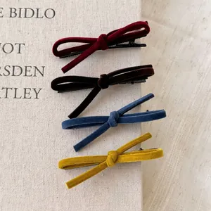 Elegant velvet bow hair clips set in burgundy, brown, blue and yellow colors
