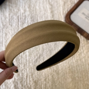 Macro detail of khaki padded headband showing high-quality twill fabric and thickness