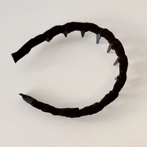 Chic black velvet twisted headband with anti-slip teeth for comfortable hair styling