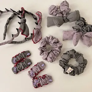 Floral gray and purple fabric hair accessory set with scrunchies and bow headbands