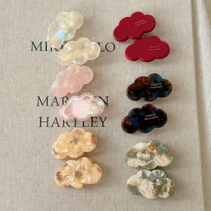 Elegant cloud-shaped acetate hair clips in assorted marble textures and colors