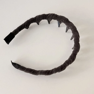 Close-up of velvet headband texture and black non-slip comb teeth for hair fixing