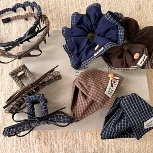 Vintage navy and brown checkered hair accessories set featuring claw clip and scrunchie