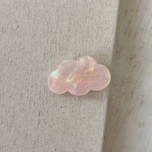 Detailed macro view of pink acetate cloud hair clip with France Handmade engraving