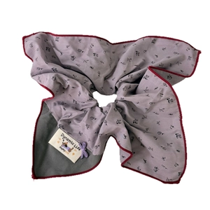 Floral purple and grey patchwork scrunchie with large bow and red stitched edges