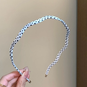 Serre-tête fin blanc à pois noirs avec motif vagues et embouts dorés pour femmes