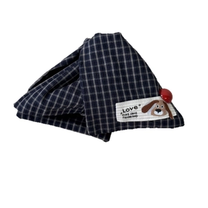 Retro dark blue plaid dog bandana with a cute cartoon puppy patch and red button detail