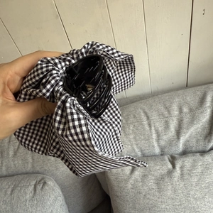 Elegant black and white houndstooth bow hair claw clip for thick hair styling