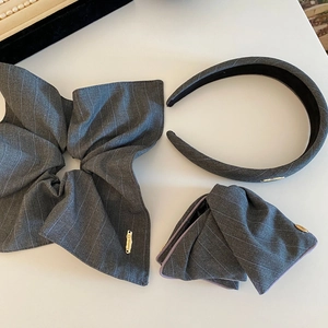Three-piece grey striped fabric hair accessory set with handmade gold metal tags