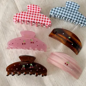 Collection of 6 acetate hair claws featuring cherry designs and rhinestone accents