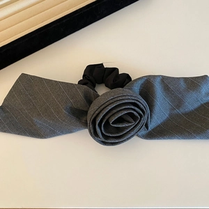 Detail of grey striped suiting fabric rose hair scrunchie with high elasticity band