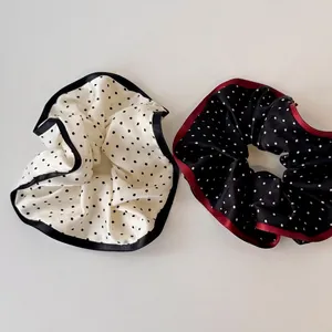 Polka dot fabric scrunchies in black and white with contrasting lace edges set