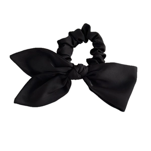 Elegant black satin hair scrunchie with large asymmetrical bow for women's hairstyle