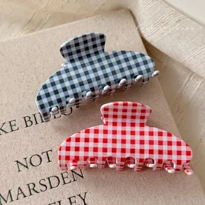 Classic checkered acetate hair claws set in blue and red gingham patterns for thick hair
