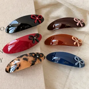Set of 6 glossy acetate hair clips with bows and rhinestones in various elegant colors