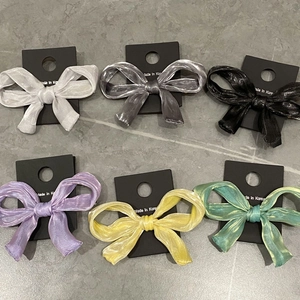 Glossy sheer bow hair clips set in six assorted pastel colors with a soft pearlescent finish