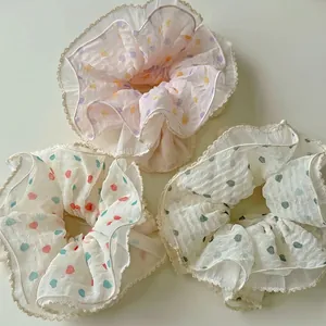 Set di tre elastici per capelli in tulle con volant, pois e motivi a cuore