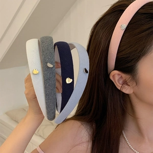Thick knitted headband for women featuring heart shaped metal sequins in multiple colors
