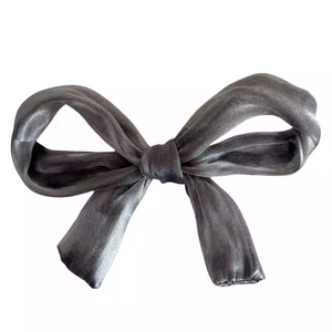 Elegant dark grey ribbon bow hair clip with a smooth fabric texture for women