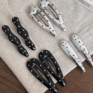 Chic polka dot pattern hair clips in teardrop and wavy shapes for women's hair styling