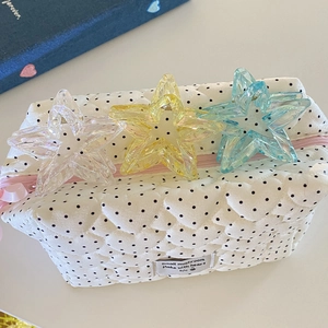 Quilted heart pattern makeup bag with three colorful star-shaped hair claw clips