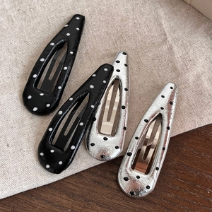 Set of four polka dot drop-shaped BB hair clips in black and silver finishes
