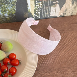 Pink wide pleated headband for women featuring a high top Korean style fabric design