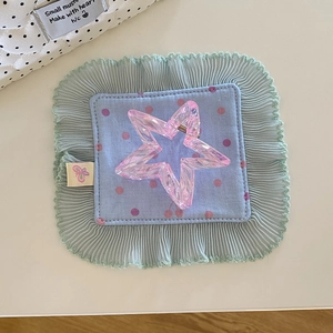 Detail of pink star hair claw with blue polka dot fabric and ruffled lace trim
