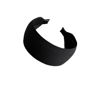 Minimalist wide black fabric headband with high cranium effect for a slim face look