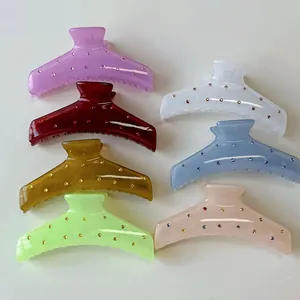 Set of 7 colorful rhinestone hair claws in resin, featuring elegant spring clip design