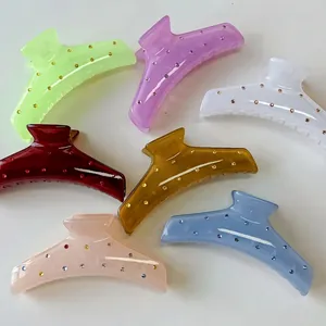 Set of colorful rhinestone hair claw clips in pastel acrylic for elegant hair styling